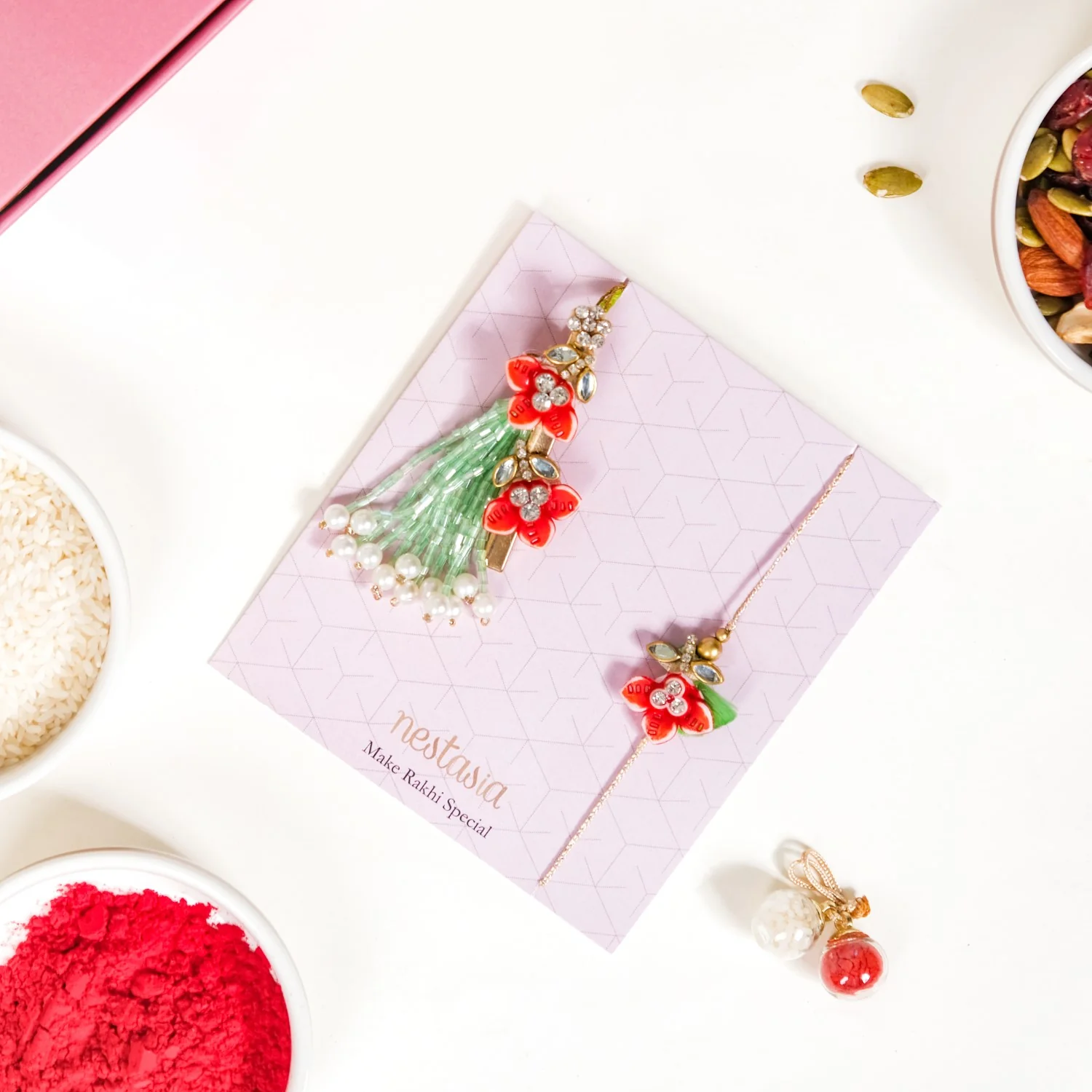 Flora Couple Rakhi Set Of 4 With Dry Fruits Gift Box Card - Image 3