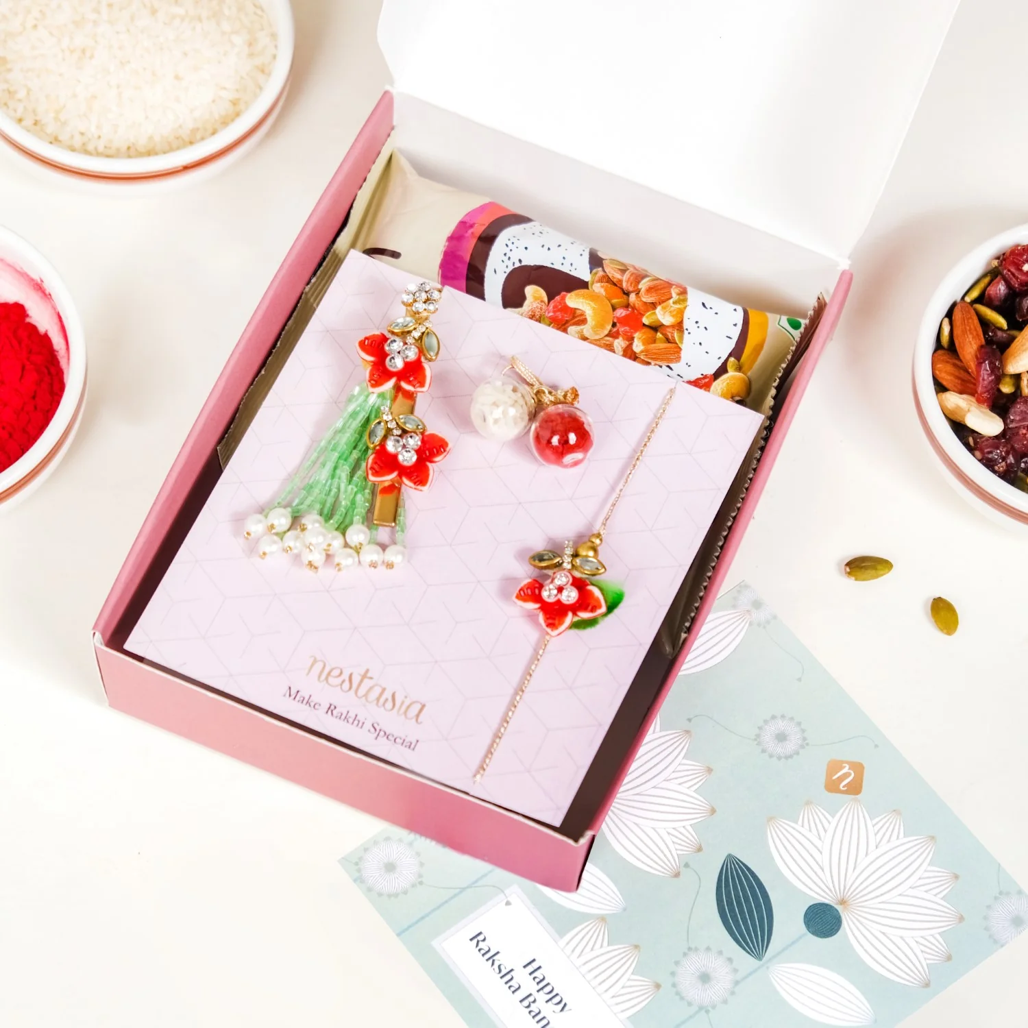 Flora Couple Rakhi Set Of 4 With Dry Fruits Gift Box Card - Image 4