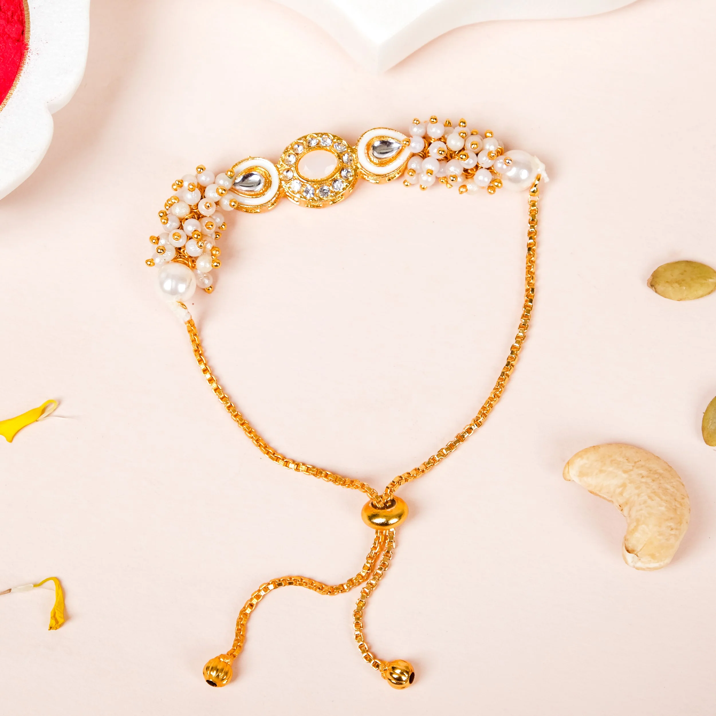 Stone And Pearl White Kundan Rakhi Set For Couple - Image 3